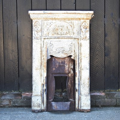 Lot 499 - A Victorian painted cast iron fire surround,...