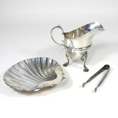 Lot 55 - An early 20th century sliver cream jug,...