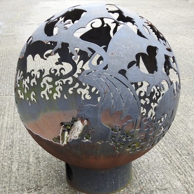 Lot 469 - A hand-made steel globe fire pit, decorated...