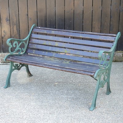 Lot 474 - A slatted wooden garden bench, with green...