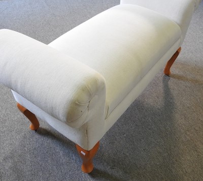 Lot 179 - A modern cream upholstered window seat, on...