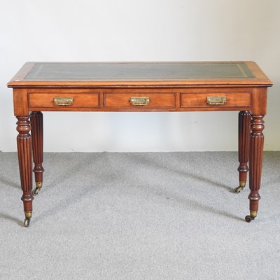 Lot 496 - A Victorian mahogany writing table, with an...