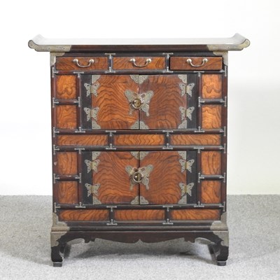 Lot 22 - A small Chinese elm cabinet, with drawers and...