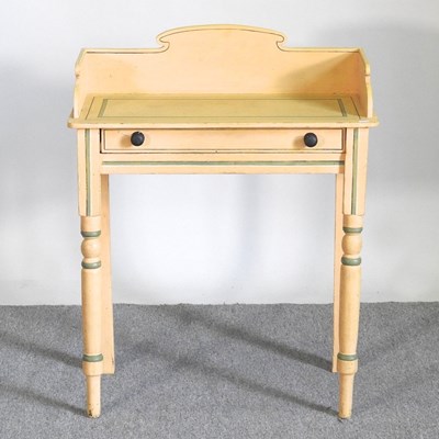 Lot 500 - An early 20th century cream painted washstand,...