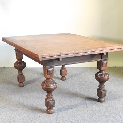 Lot 61 - A large early 20th century oak draw-leaf...