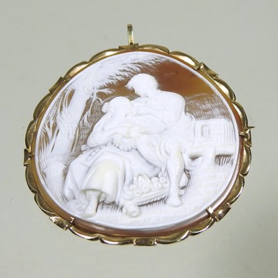 Lot 65 - A cameo brooch, of circular shape, carved with...