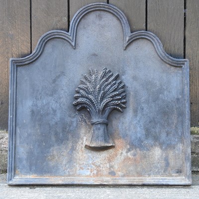 Lot 428 - A cast iron fireback, of arched shape, relief...