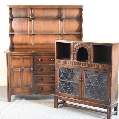 Lot 502 - An Ercol dark elm dresser, together with a...