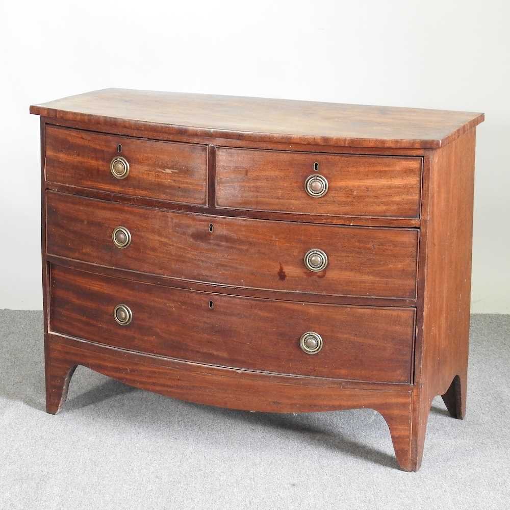 Lot 632 - A 19th century mahogany bow front chest of
