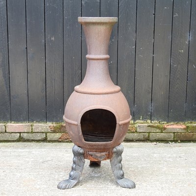 Lot 553 - A cast iron chiminea, 111cm high