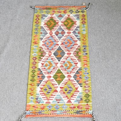 Lot 68 - A kelim rug, with all over diamond pattern, on...