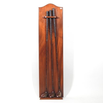 Lot 544 - Three vintage Walker golf clubs, mounted on a...