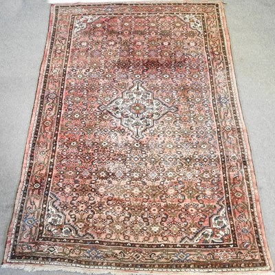 Lot 667 - An Iranian woollen carpet