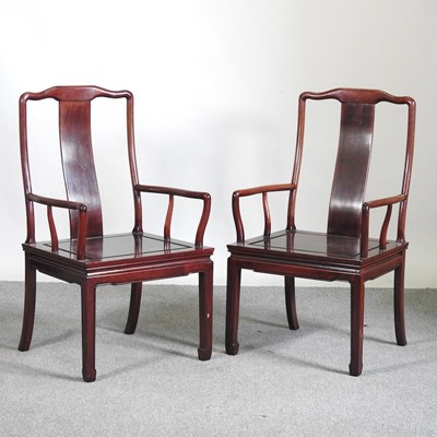 Lot 259 - A pair of Chinese rosewood elbow chairs, 20th...