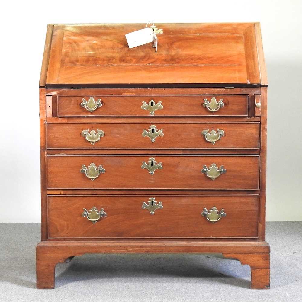 Lot 168 - A George III mahogany bureau, with a fitted...