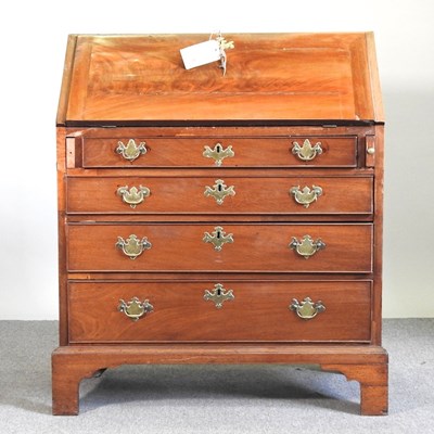 Lot 168 - A George III mahogany bureau, with a fitted...