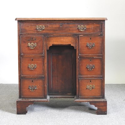 Lot 380 - A George I style kneehole desk, early 20th...