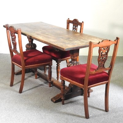 Lot 592 - A 1920's oak refectory dining table, on cup...