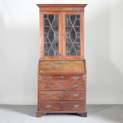 Lot 564 - A George III mahogany bureau bookcase, with an...