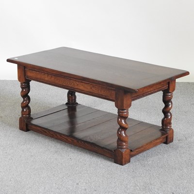 Lot 97 - An oak coffee table, with an undertier