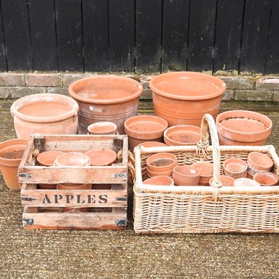 Lot 320 - A collection of terracotta garden pots,...