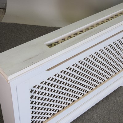 Lot 105 - A pair of white painted wooden radiator covers...