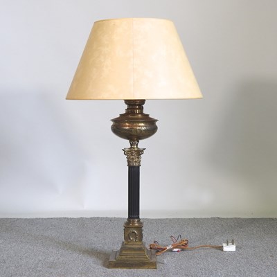 Lot 406 - A brass column table lamp and shade, 91cm high