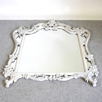 Lot 496 - An ornate gilt framed wall mirror, with a...