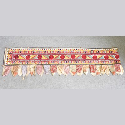 Lot 398 - An Indian embroidered valance or pelmet, 460cm...