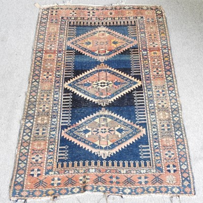 Lot 271 - A Persian Bokhara rug, with three central...