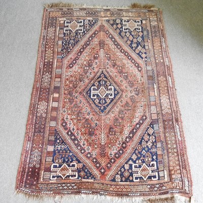 Lot 608 - A Persian Qashqai woollen rug, with a central...