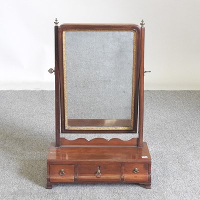 Lot 225 - A George III mahogany swing frame toiletry...