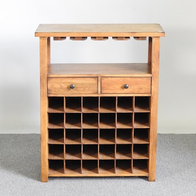 Lot 595 - A modern oak wine rack, containing a pair of...