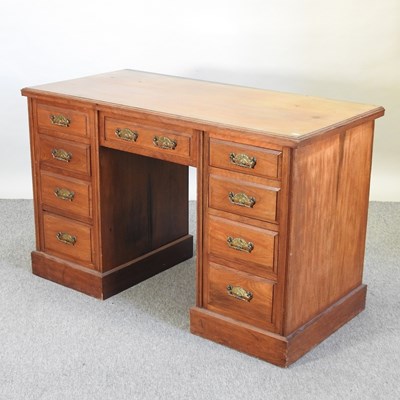 Lot 686 - An Edwardian walnut pedestal desk by Maple and Co.