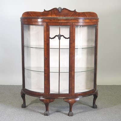 Lot 637 - A 1920's mahogany bow front glazed display...