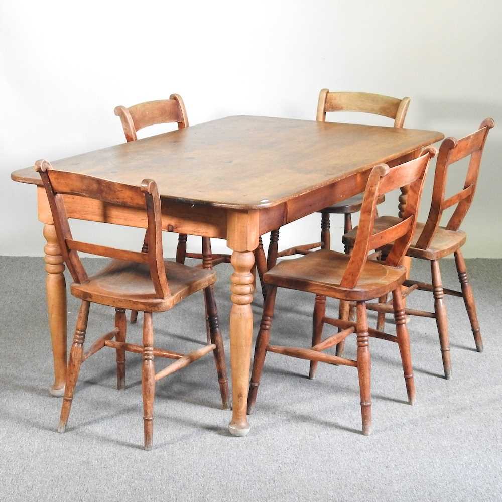 Lot 125 - A pine dining table, on turned legs, together...
