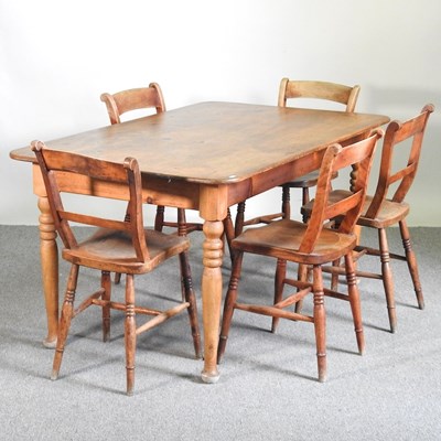 Lot 125 - A pine dining table, on turned legs, together...