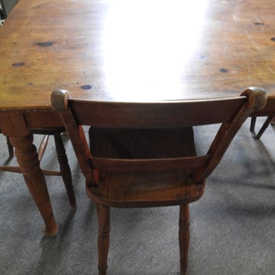 Lot 125 - A pine dining table, on turned legs, together...