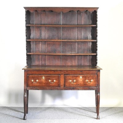 Lot 575 - An 18th century oak dresser, with a boarded...