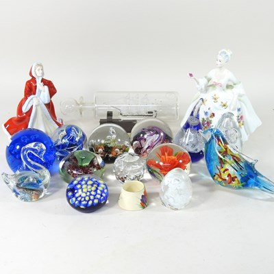 Lot 631 - A collection of glass paperweights, together...