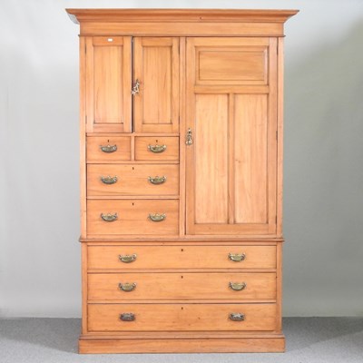 Lot 483 - An Edwardian satin walnut combination wardrobe,...