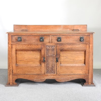 Lot 58 - An Arts and Crafts oak sideboard, with a...