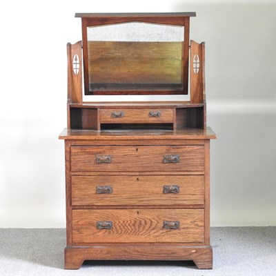 Lot 313 - An Arts and Crafts oak dressing chest,...