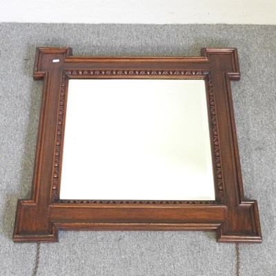 Lot 262 - An early 20th century oak framed wall mirror,...