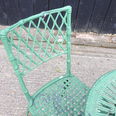 Lot 149 - A green painted cast iron garden table, 56cm...