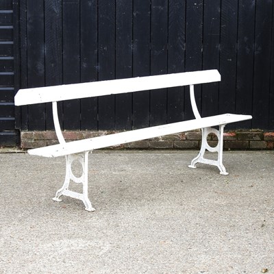 Lot 390 - A white painted wooden garden bench, on metal...