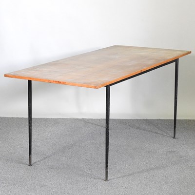 Lot 448 - A 1960's dining table, on metal legs, in the...