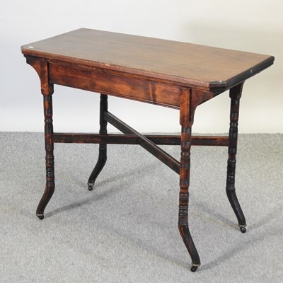 Lot 688 - An Edwardian folding card table, on turned legs