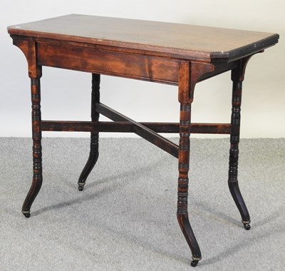 Lot 688 - An Edwardian folding card table, on turned legs