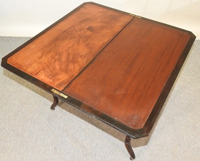 Lot 688 - An Edwardian folding card table, on turned legs